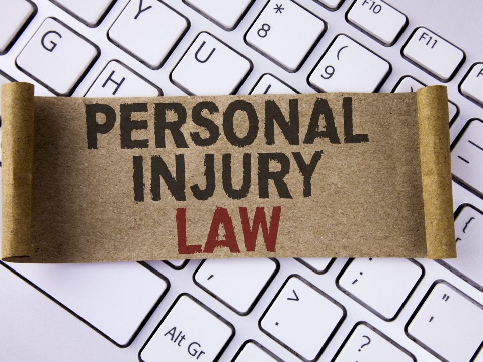 Conceptual hand writing showing Personal Injury Law. Business photo showcasing guarantee your rights in case of hazards or risks written Folded Cardboard Paper Piece placed Keyboard.