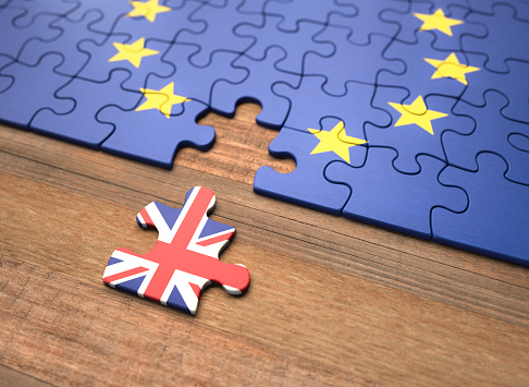 a puzzle of the European Unin with a recessed puzzle piece representing the United Kingdom