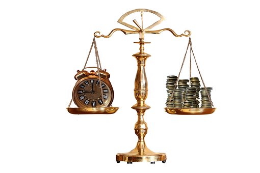 Balance with money on one side and a watch on the other