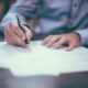Man signing documents