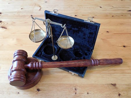 The judge's gavel and a scale of justice