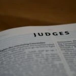 An open bible on the chapter of Judges